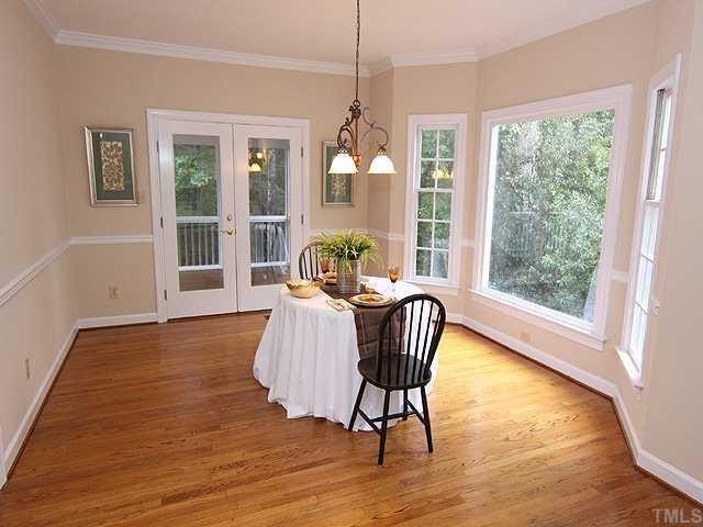The dining room is graced with a brand new light fixture, large bay window and access to the screened porch and deck. Just lovely . . . Dining Room