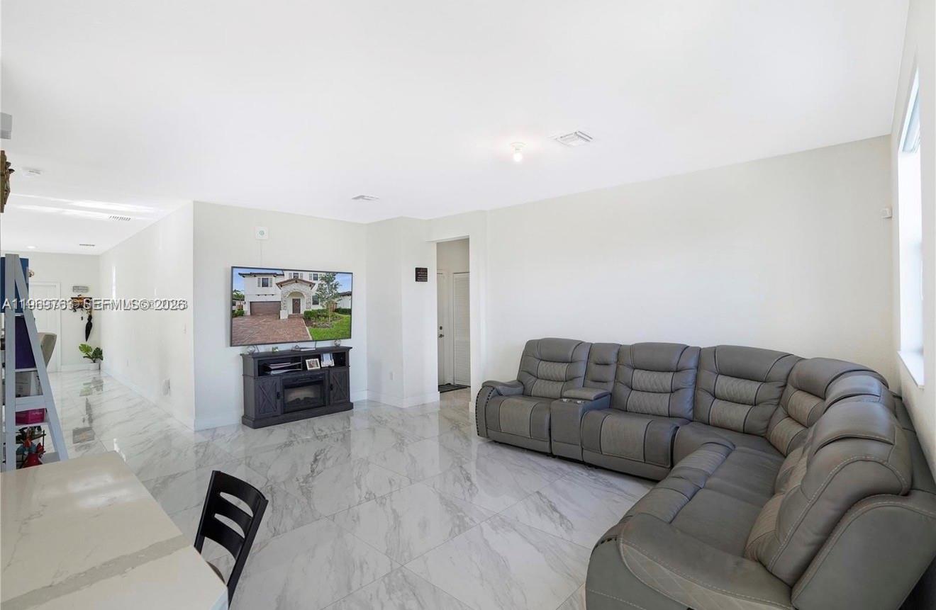 10321 Southwest 232nd Street Cutler Bay, FL 33190 - Photo 12 of 49 a living room with furniture