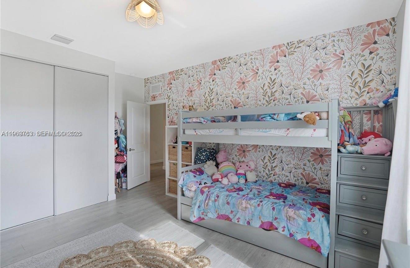 10321 Southwest 232nd Street Cutler Bay, FL 33190 - Photo 33 of 49 a bed room with a bed