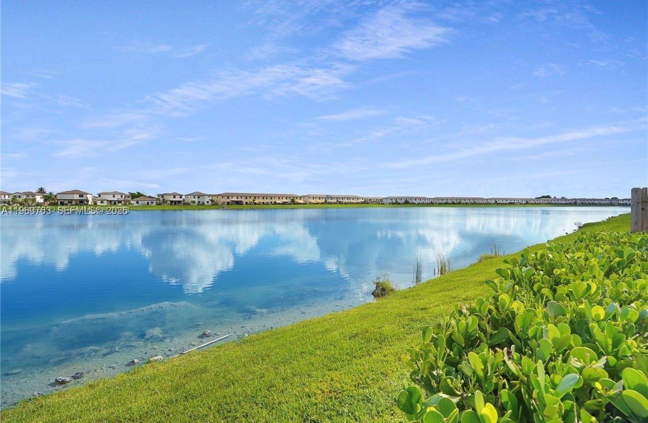 10321 Southwest 232nd Street Cutler Bay, FL 33190 - Photo 47 of 49 a view of a lake with houses in the back