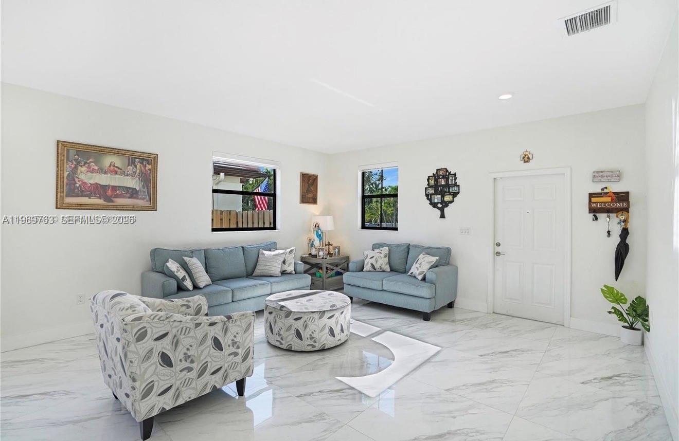 10321 Southwest 232nd Street Cutler Bay, FL 33190 - Photo 6 of 49 a living room with furniture and a couch
