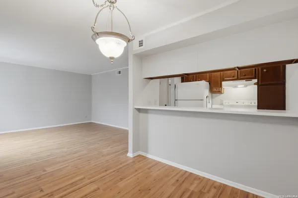 a kitchen with a sink and a refrigerator
