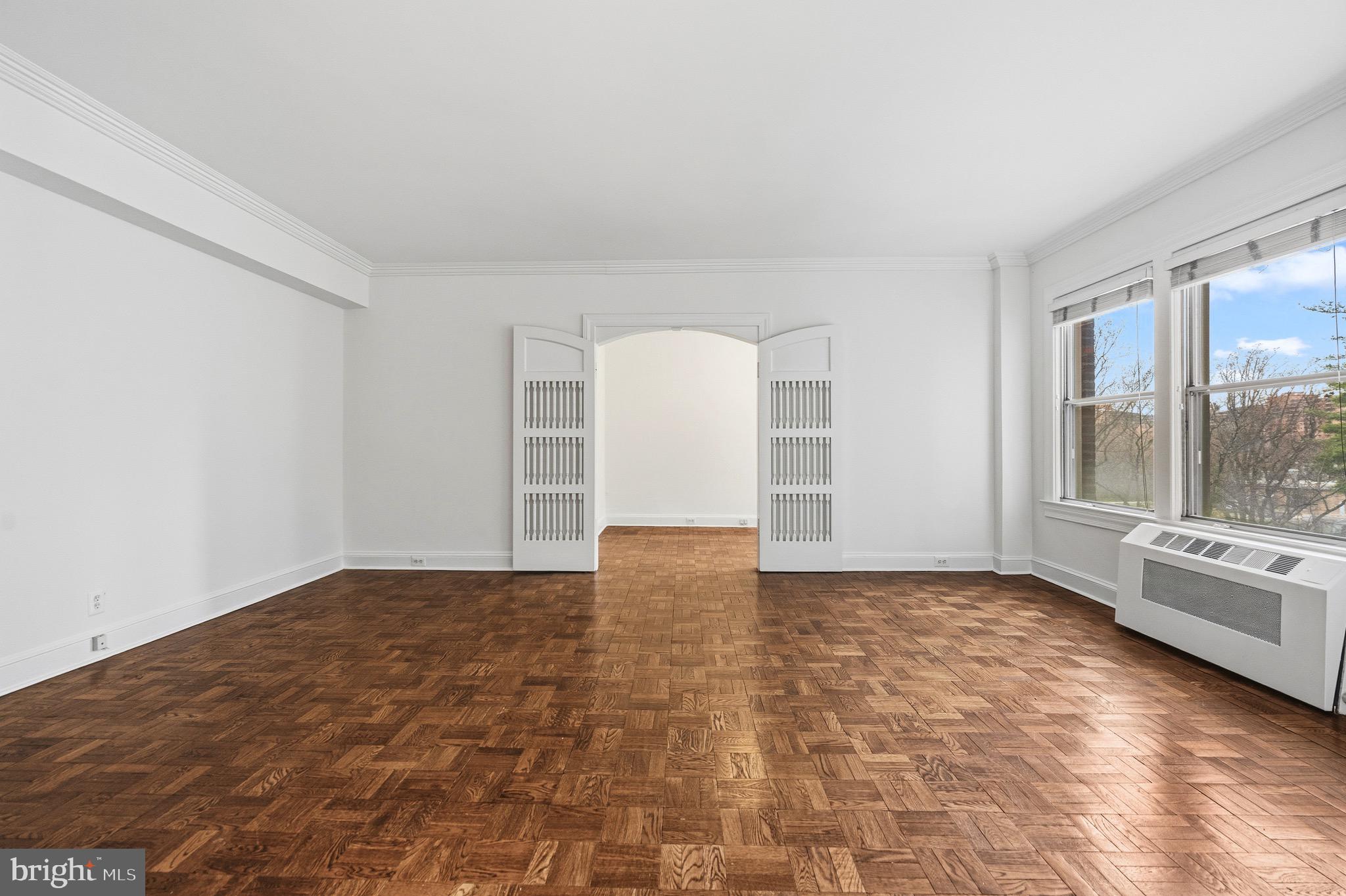 4000 Cathedral Avenue Northwest, Unit 334B/335B Washington, DC 20016 - Photo 11 of 32 a view of an empty room with glass door