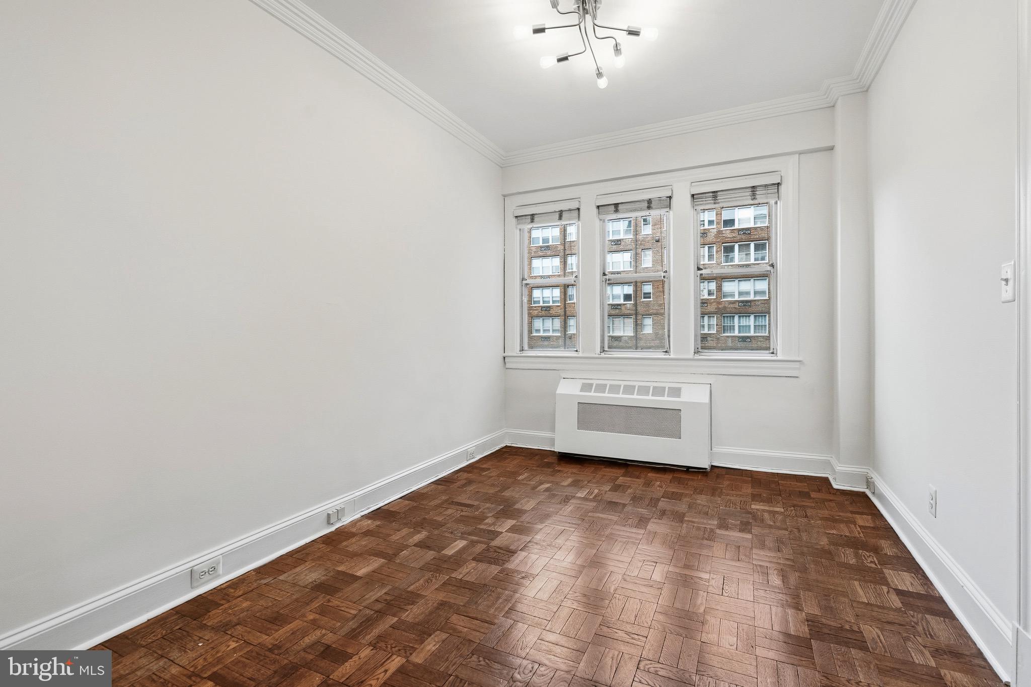 4000 Cathedral Avenue Northwest, Unit 334B/335B Washington, DC 20016 - Photo 14 of 32 an empty room with windows