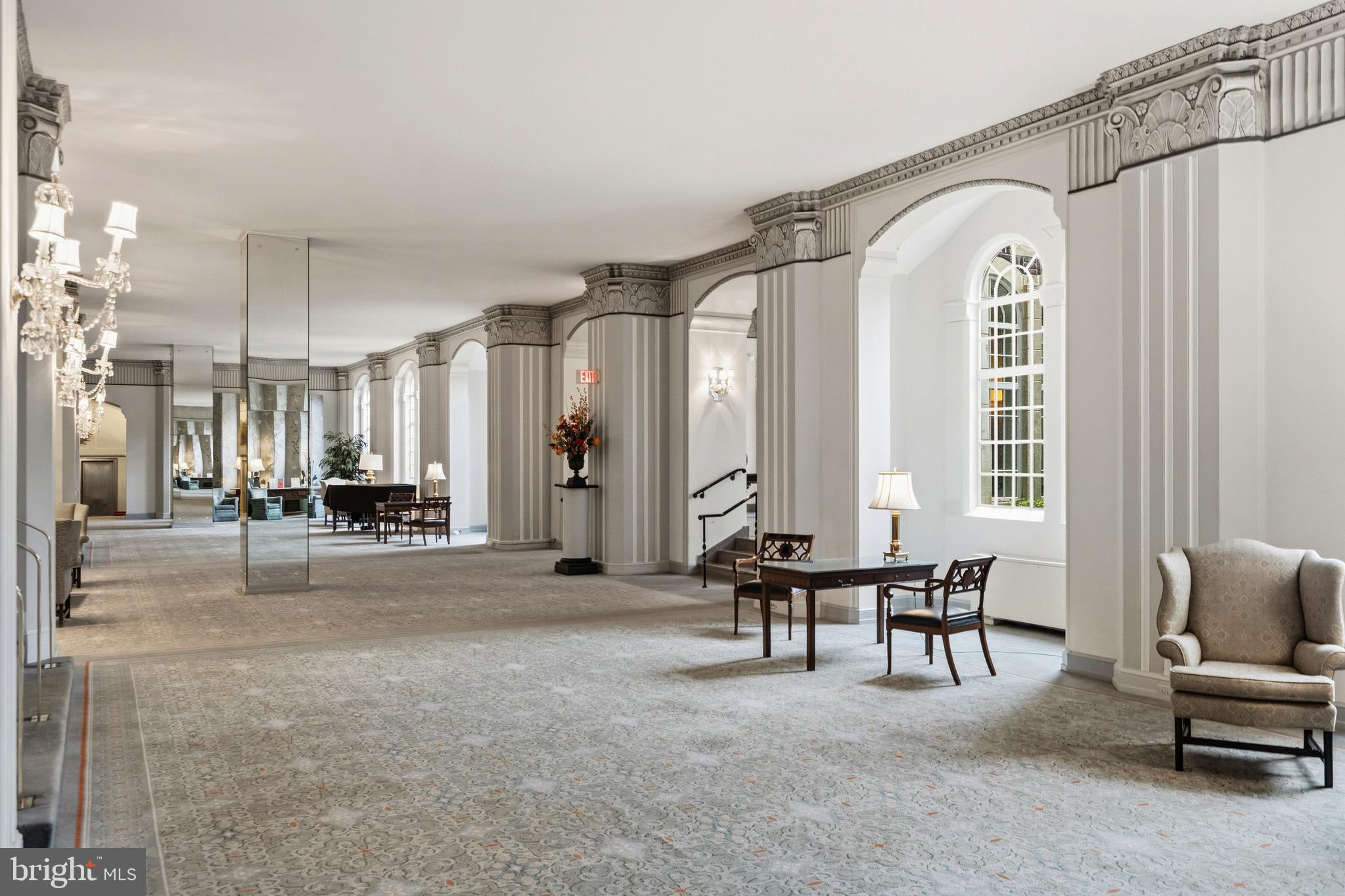 4000 Cathedral Avenue Northwest, Unit 334B/335B Washington, DC 20016 - Photo 27 of 32 a living room with furniture and a large window