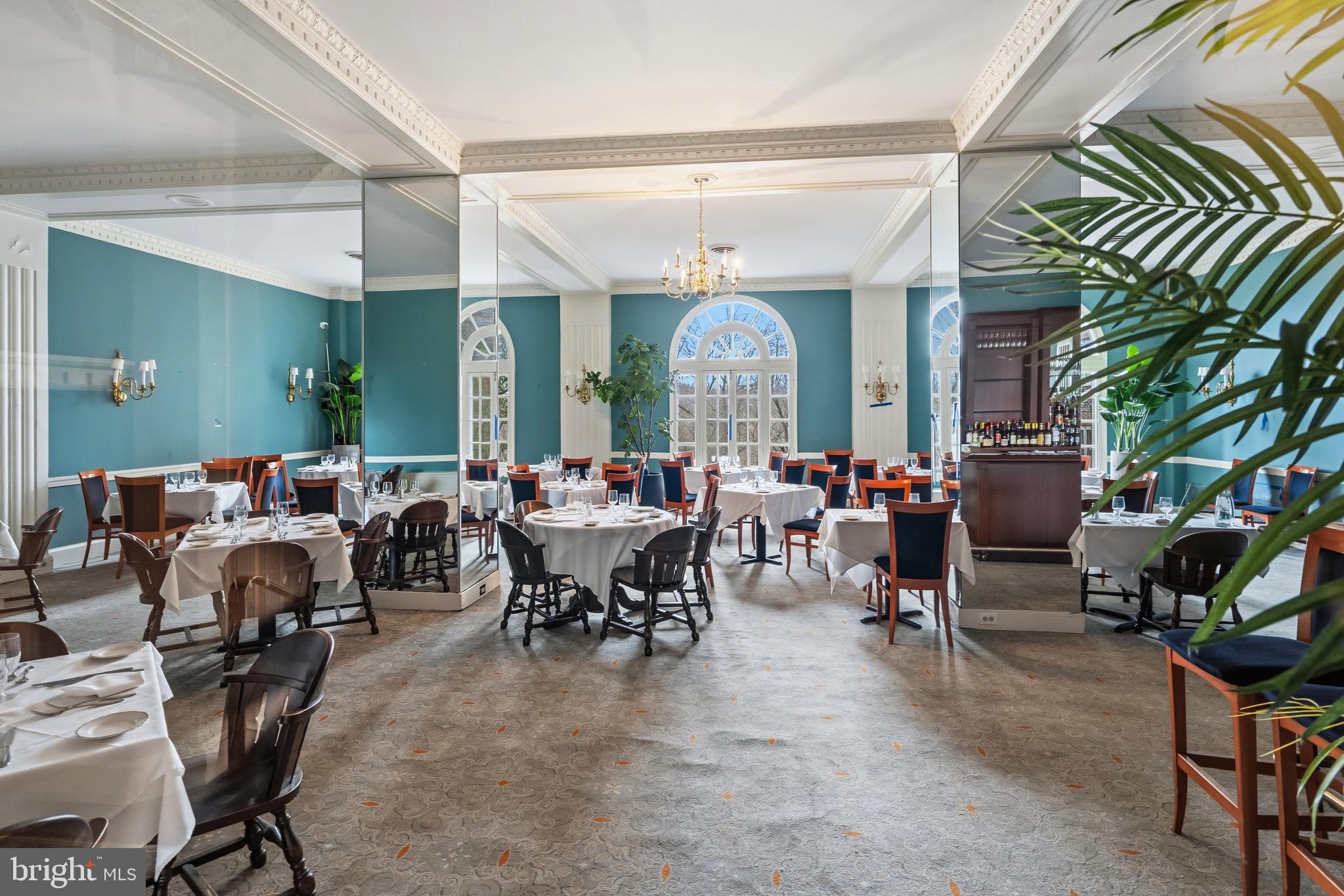 4000 Cathedral Avenue Northwest, Unit 334B/335B Washington, DC 20016 - Photo 28 of 32 a living room with lots of furniture and a large window