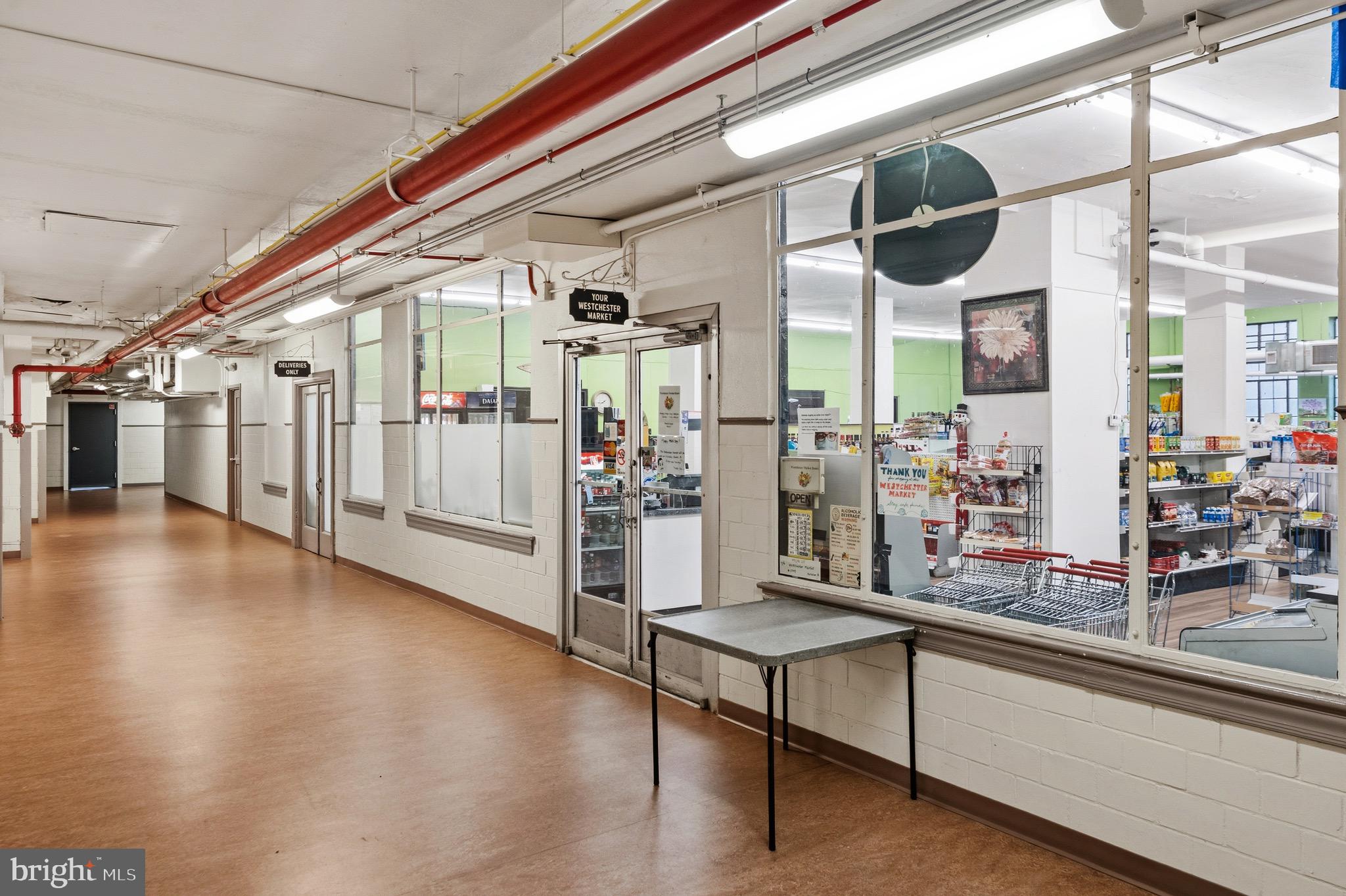 4000 Cathedral Avenue Northwest, Unit 334B/335B Washington, DC 20016 - Photo 29 of 32 a view of a living room with furniture and a large window