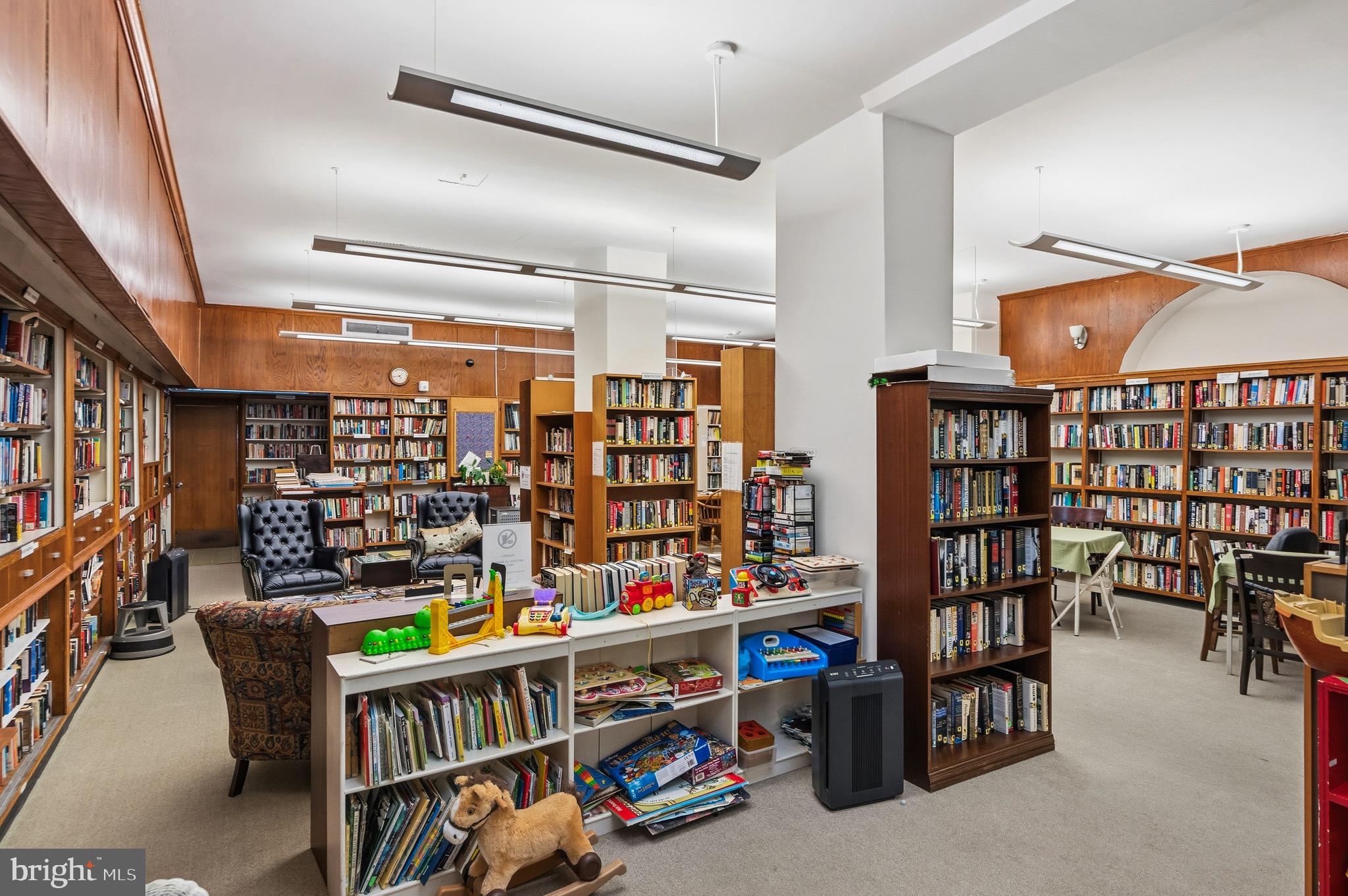 4000 Cathedral Avenue Northwest, Unit 334B/335B Washington, DC 20016 - Photo 30 of 32 a room with lots of furniture and clutter