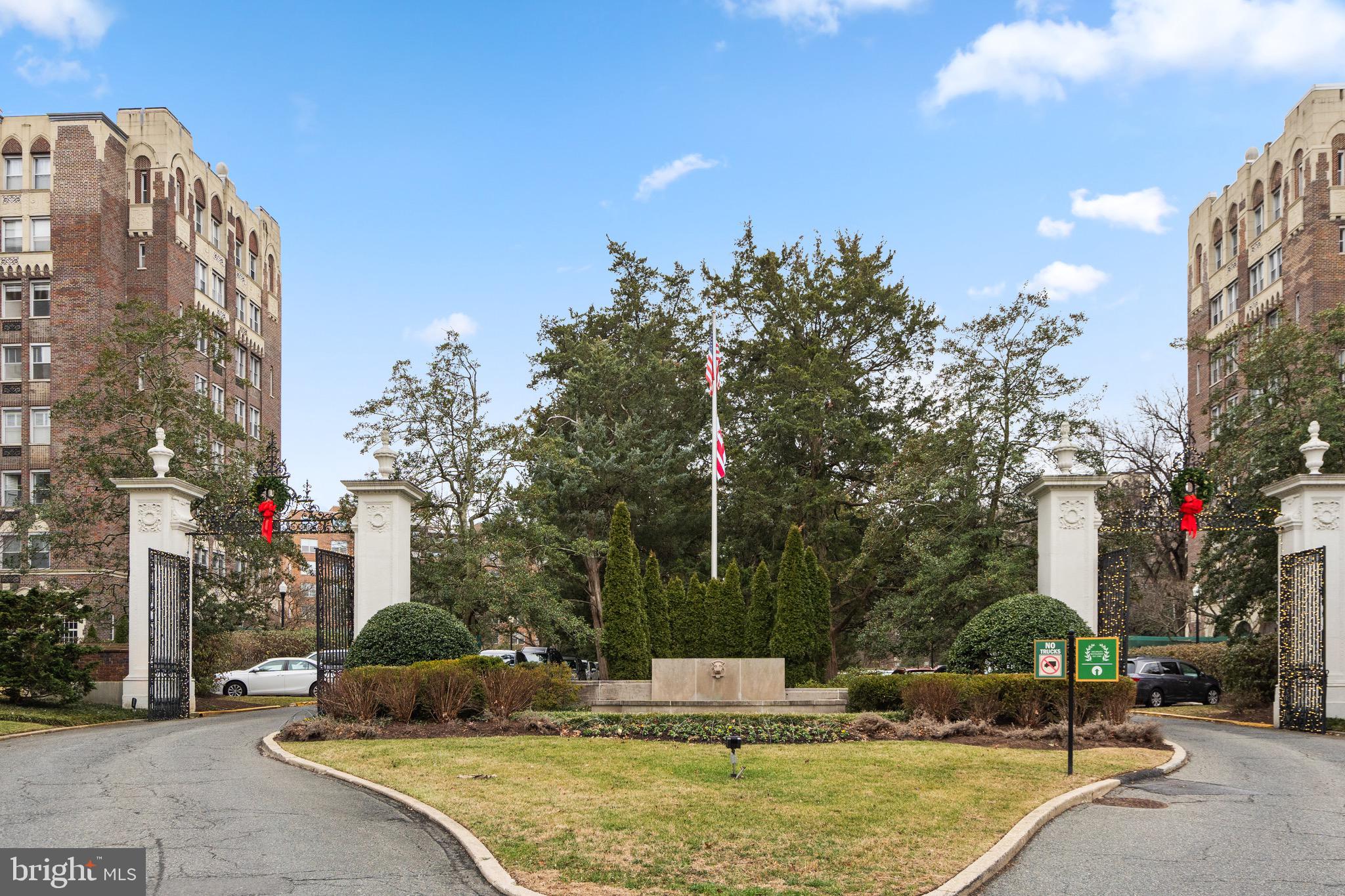 4000 Cathedral Avenue Northwest, Unit 334B/335B Washington, DC 20016 - Photo 32 of 32 a view of a swimming pool with a building in the background