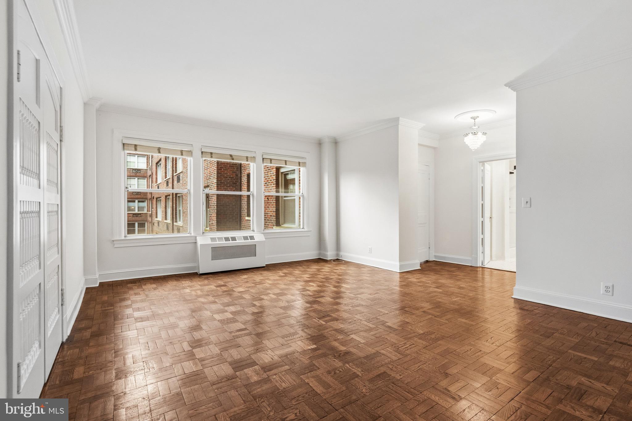 4000 Cathedral Avenue Northwest, Unit 334B/335B Washington, DC 20016 - Photo 10 of 32 a view of an empty room with a window
