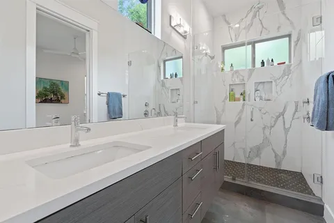 a bedroom with bed and a window