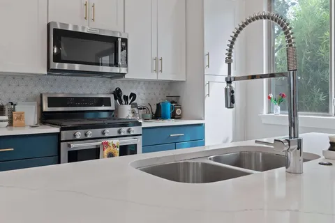 a kitchen with a sink and a microwave