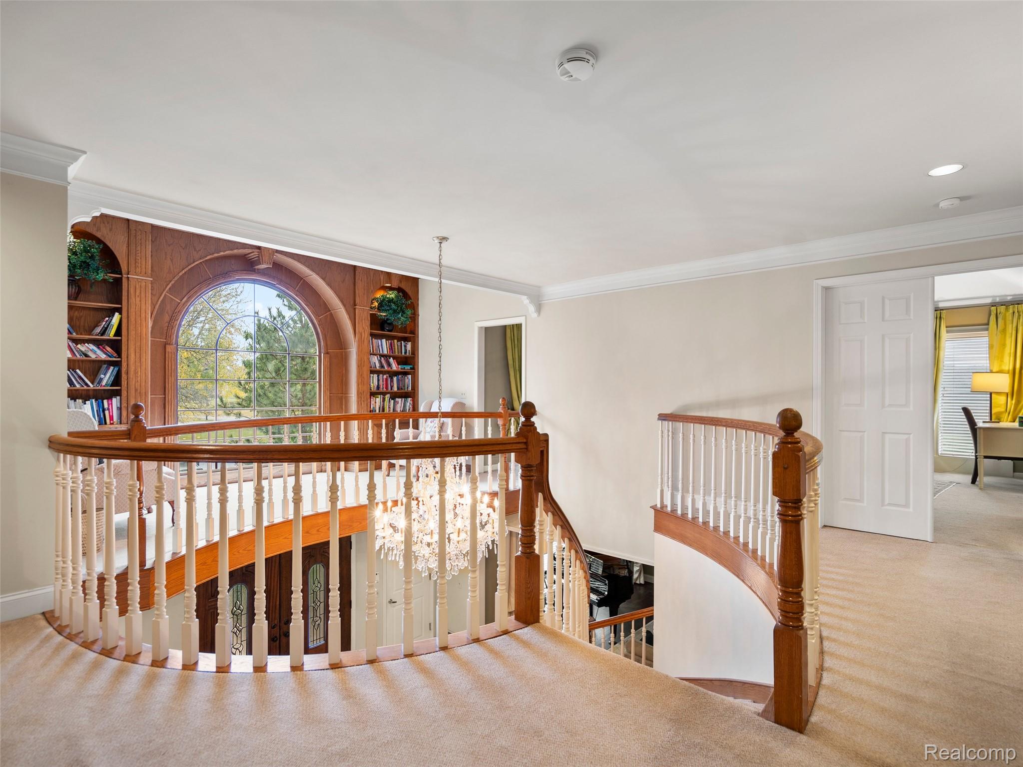 5724 Murfield Drive Rochester, MI 48306 - Photo 68 of 99 Corridor featuring crown molding, carpet floors, and an upstairs landing