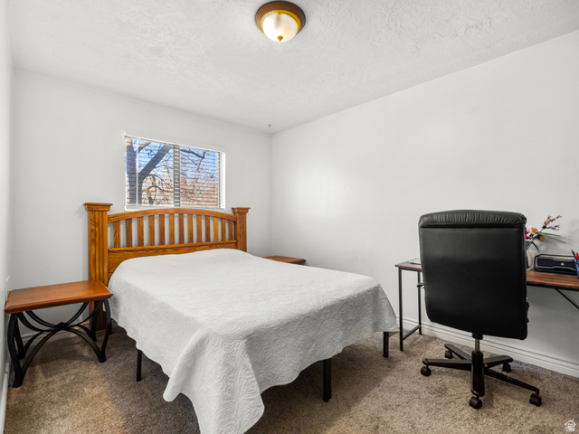 460 200 South Provo, UT 84606 - Photo 46 of 66 Carpeted bedroom with an office area and a textured ceiling