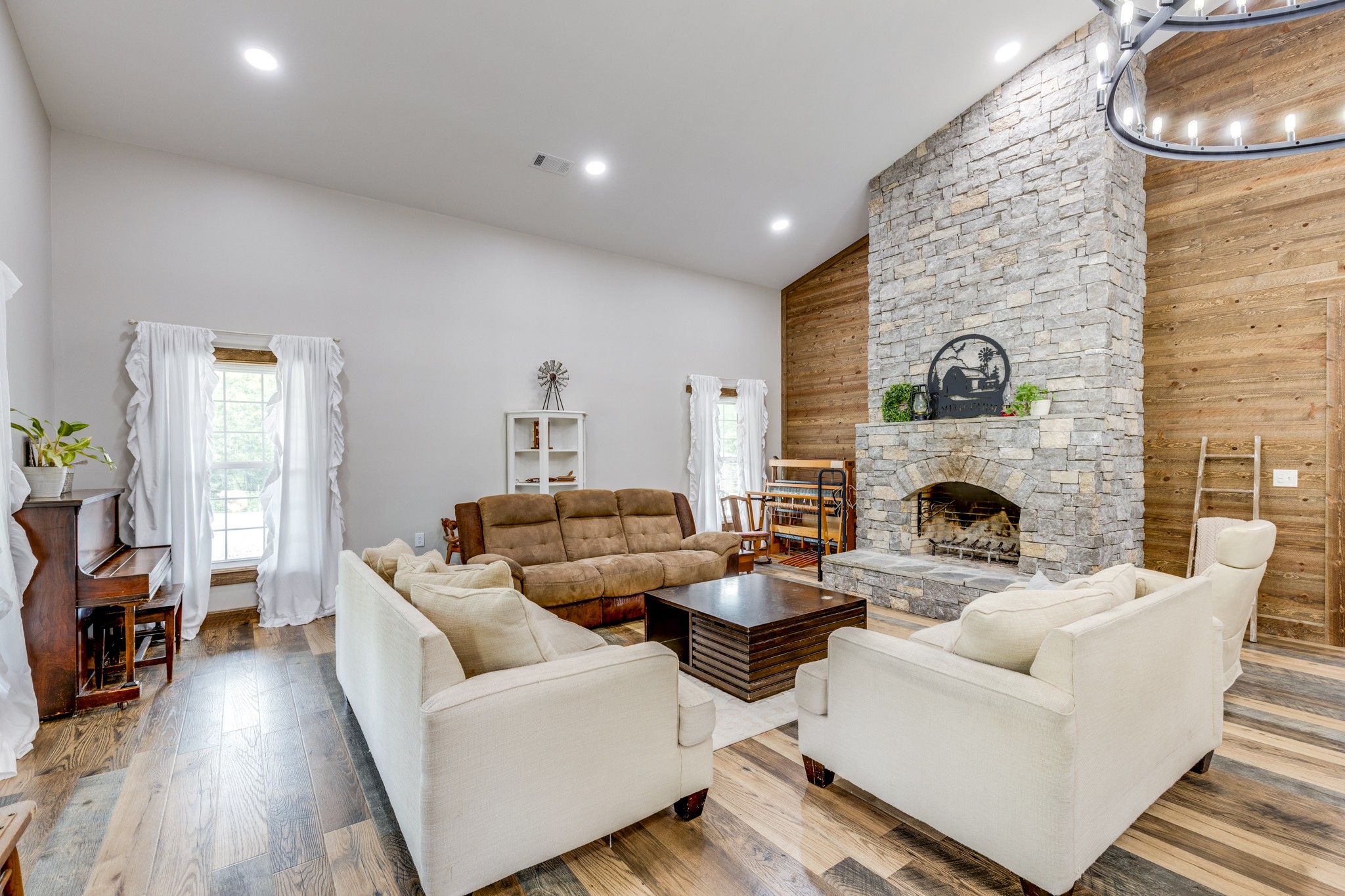 2790 9 Mile Ridge Road Duck River, TN 38454 - Photo 11 of 70 a living room with furniture and a fireplace