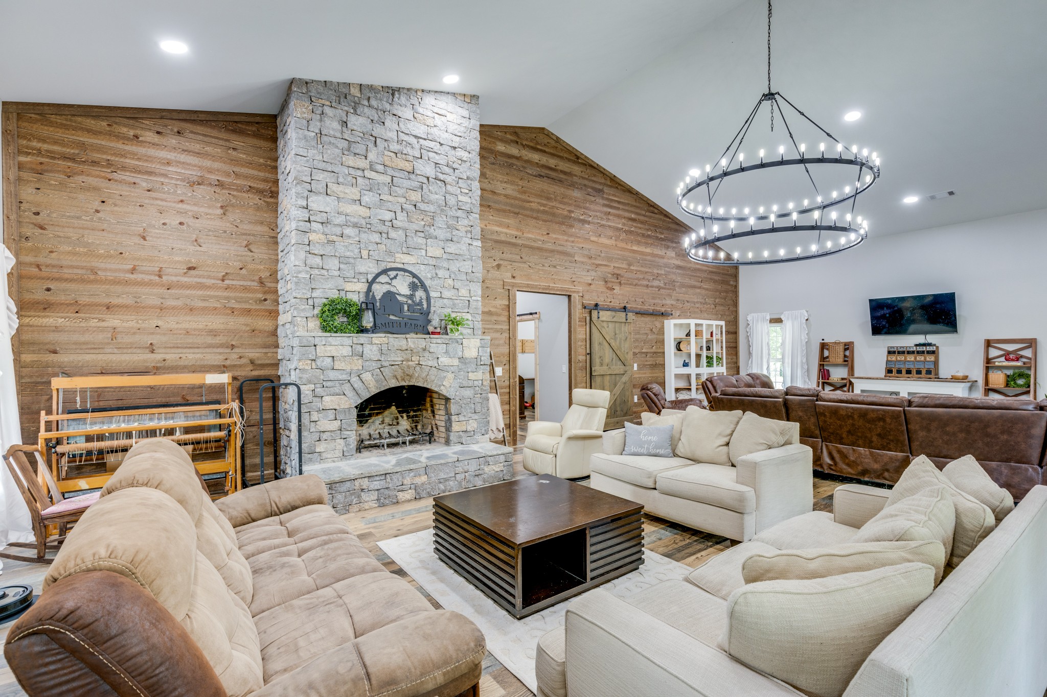 2790 9 Mile Ridge Road Duck River, TN 38454 - Photo 12 of 70 a living room with furniture a fireplace and a chandelier