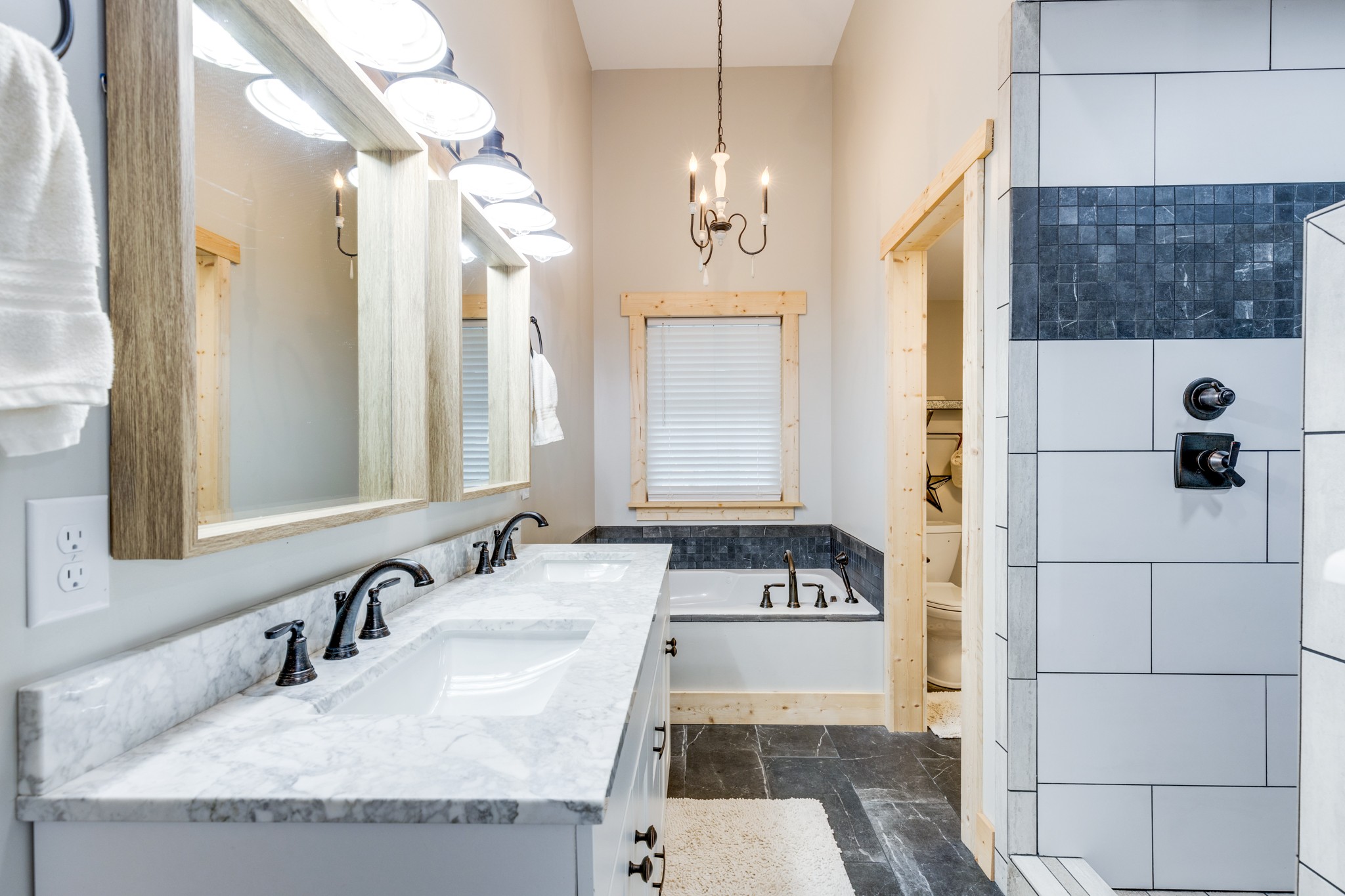 2790 9 Mile Ridge Road Duck River, TN 38454 - Photo 20 of 70 a bathroom with a granite countertop sink a mirror and shower