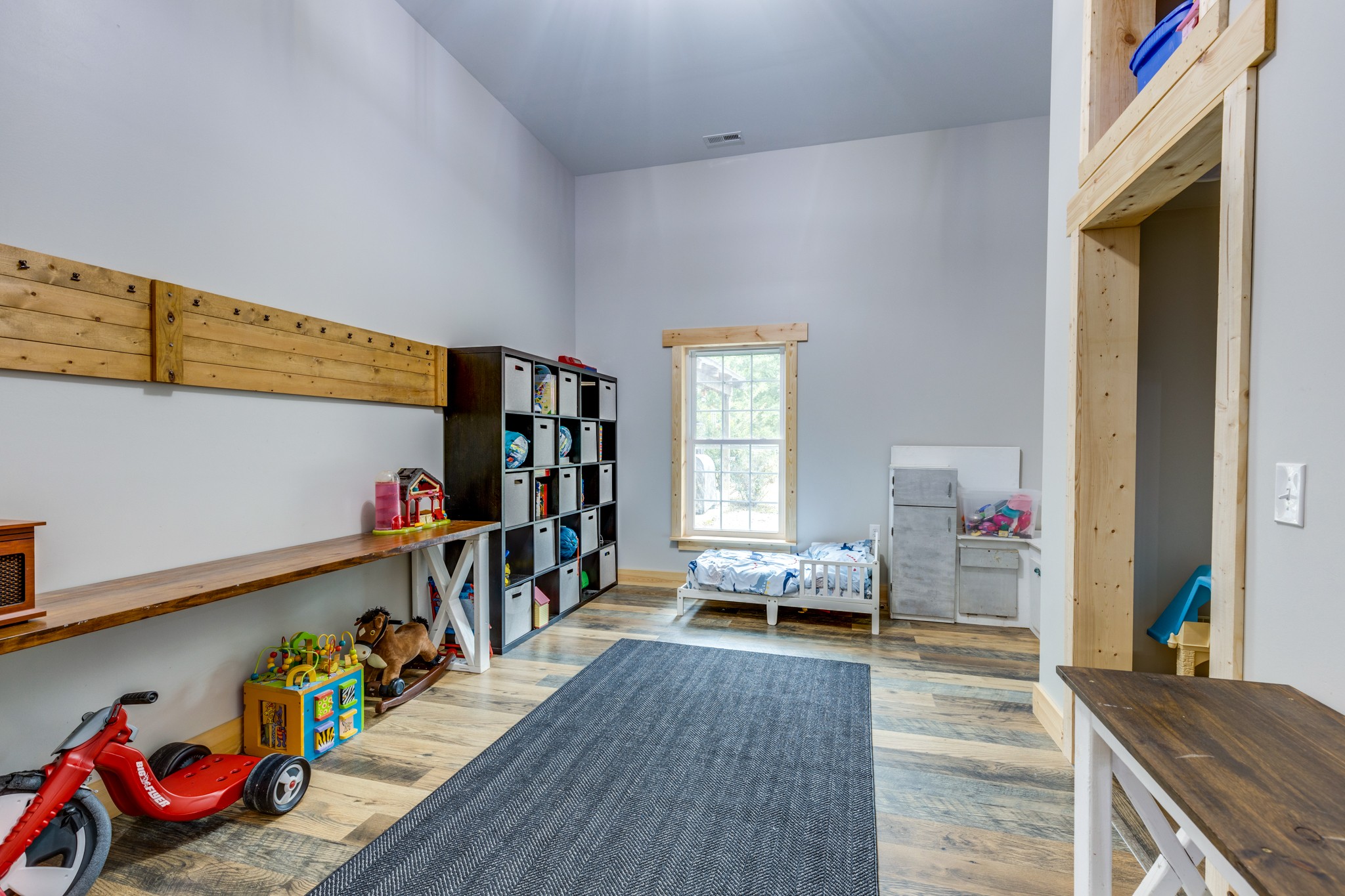 2790 9 Mile Ridge Road Duck River, TN 38454 - Photo 22 of 70 a living room with lots of furniture and toys