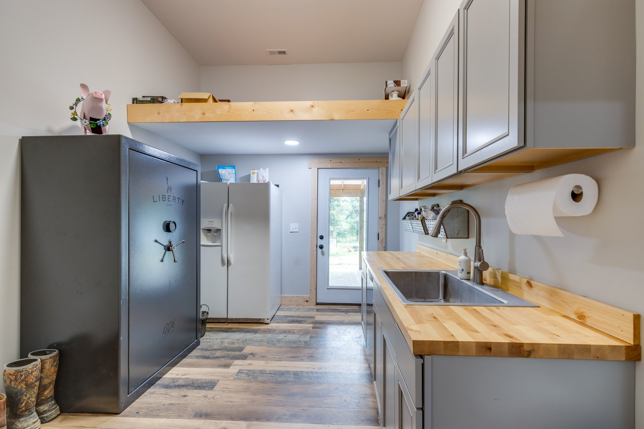 2790 9 Mile Ridge Road Duck River, TN 38454 - Photo 26 of 70 a kitchen with stainless steel appliances granite countertop a sink and a refrigerator