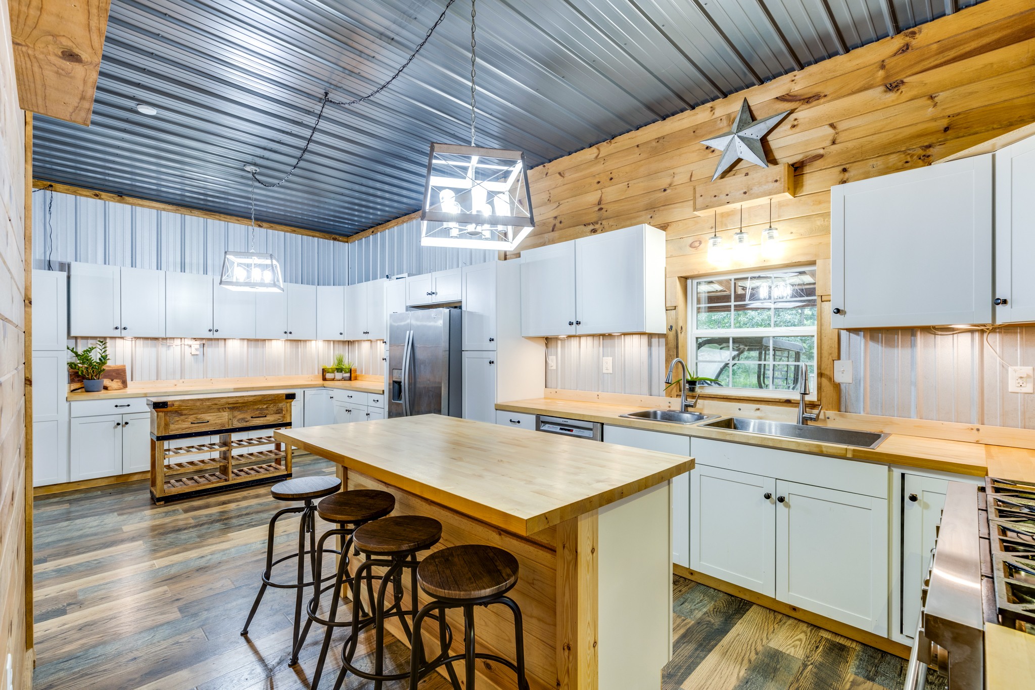 2790 9 Mile Ridge Road Duck River, TN 38454 - Photo 31 of 70 a kitchen with a sink a stove a refrigerator and wooden cabinets