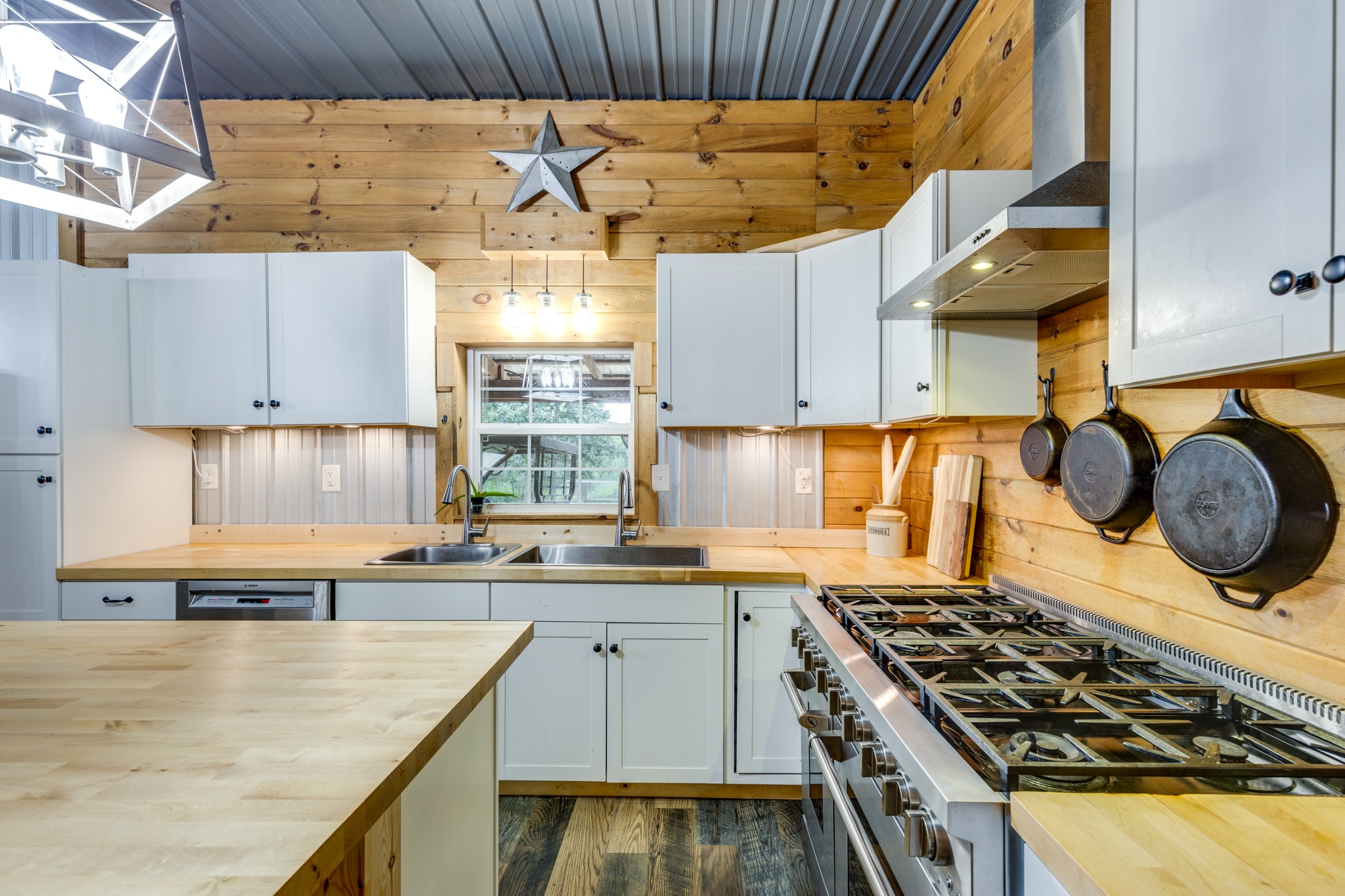 2790 9 Mile Ridge Road Duck River, TN 38454 - Photo 33 of 70 a kitchen with a stove a sink and a wooden cabinets