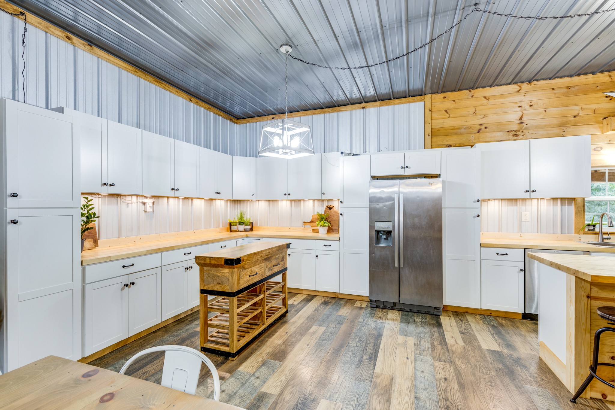 2790 9 Mile Ridge Road Duck River, TN 38454 - Photo 35 of 70 a kitchen with granite countertop a sink cabinets and stainless steel appliances