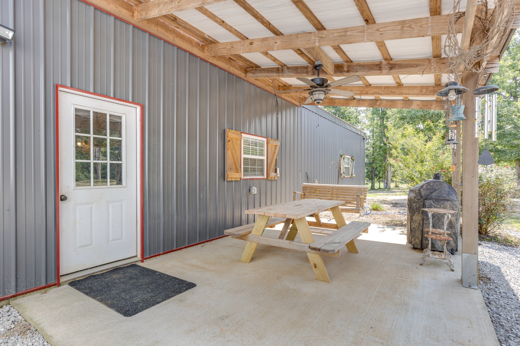2790 9 Mile Ridge Road Duck River, TN 38454 - Photo 44 of 70 a backyard of a house with outdoor seating