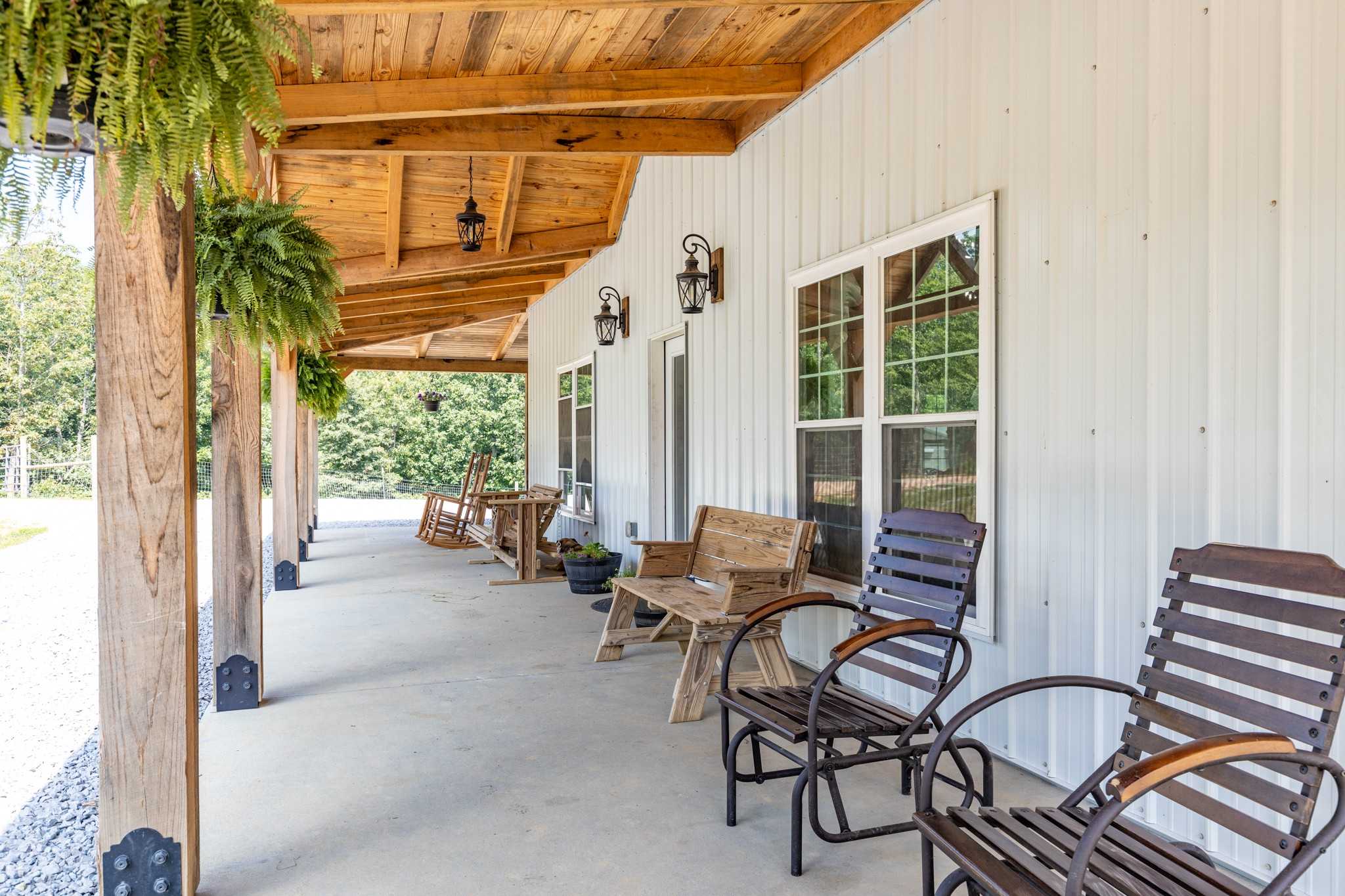 2790 9 Mile Ridge Road Duck River, TN 38454 - Photo 6 of 70 a building outdoor space with patio furniture and potted plants