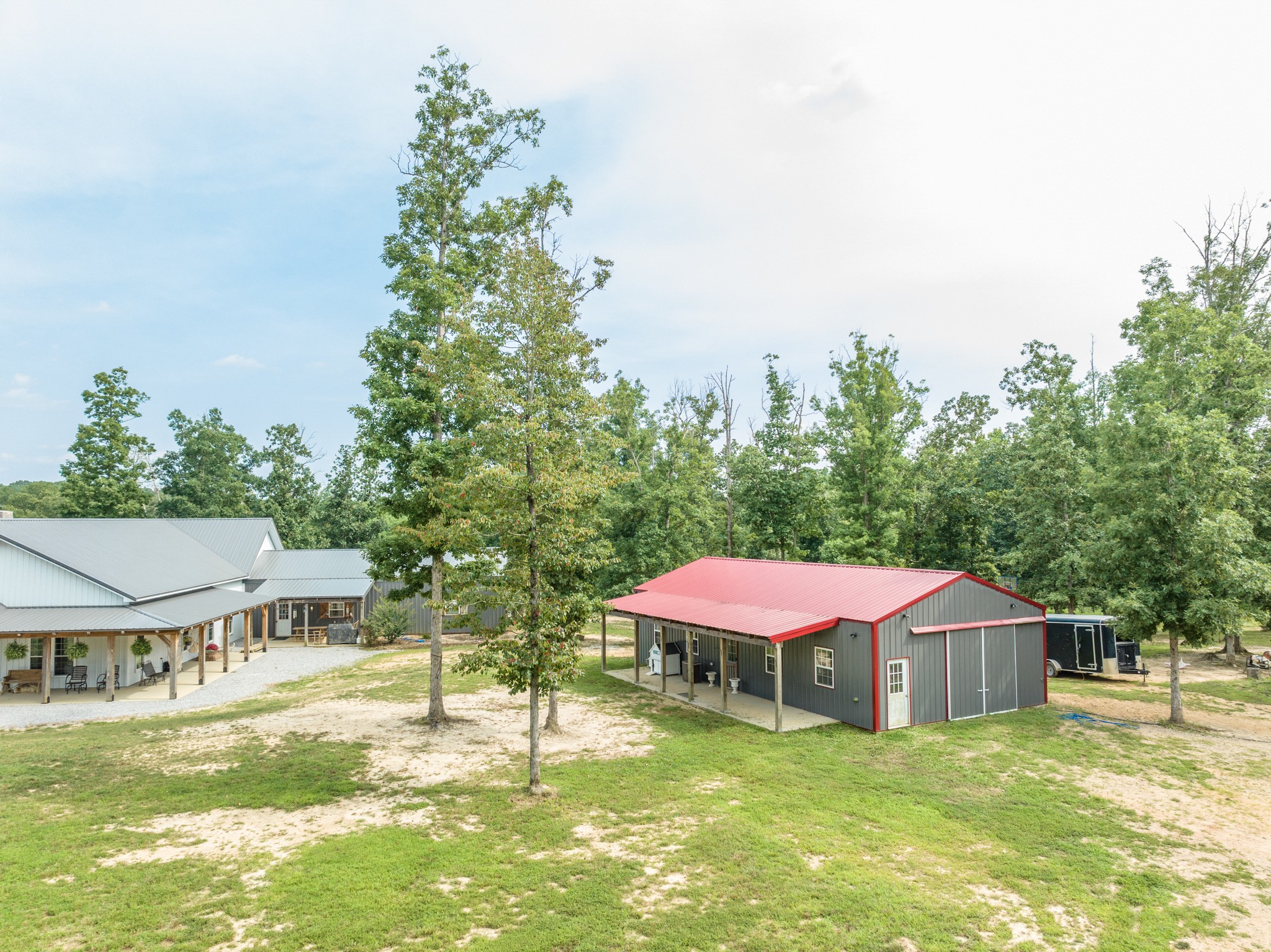 2790 9 Mile Ridge Road Duck River, TN 38454 - Photo 68 of 70 a view of a patio with a table and chairs under an umbrella
