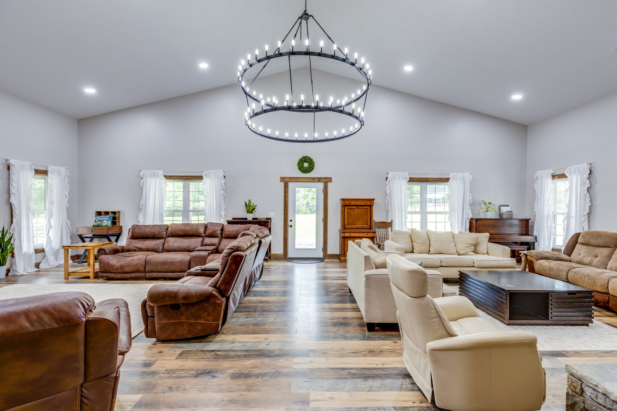 2790 9 Mile Ridge Road Duck River, TN 38454 - Photo 10 of 70 a living room with furniture a chandelier and a window
