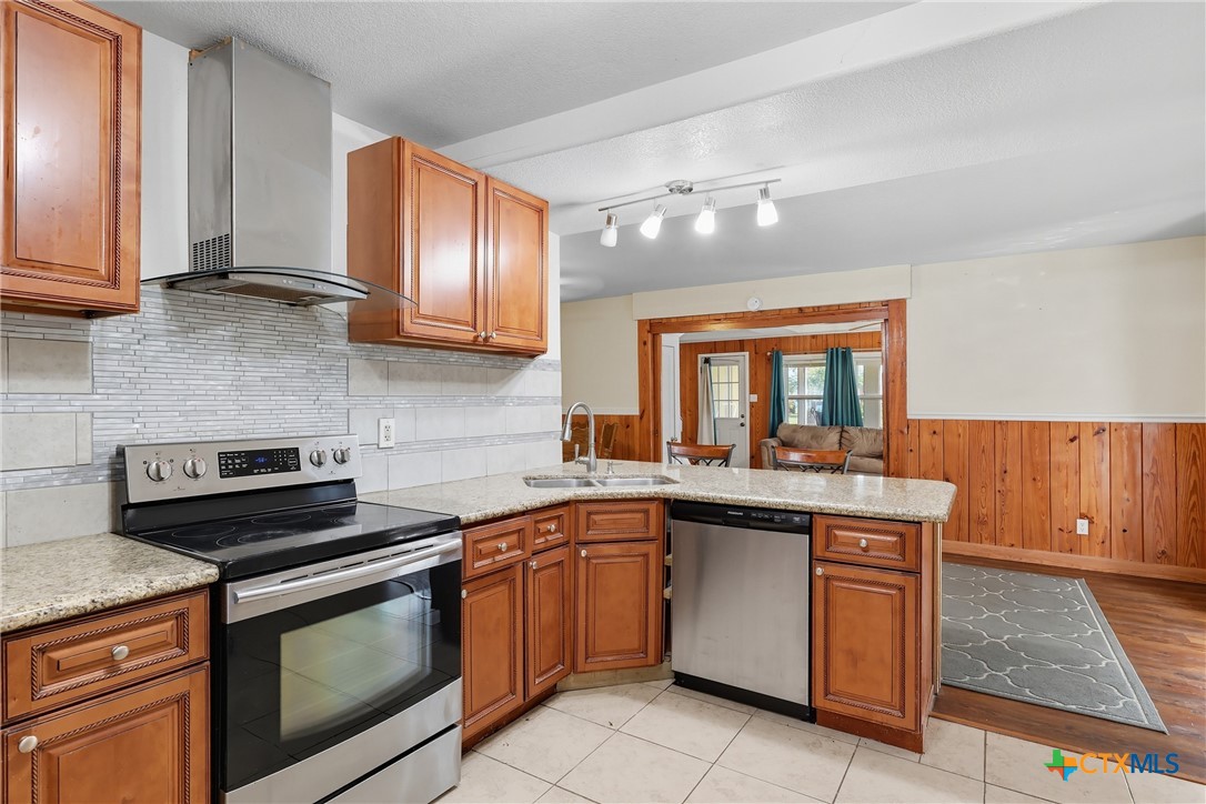 488 Alamo Beach Avenue Port Lavaca, TX 77979 - Photo 13 of 36 a kitchen with a sink stove top oven and cabinets