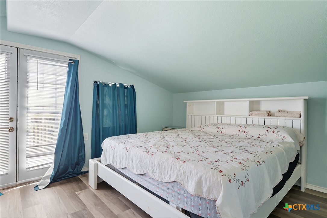 488 Alamo Beach Avenue Port Lavaca, TX 77979 - Photo 18 of 36 a bedroom with a bed and a window