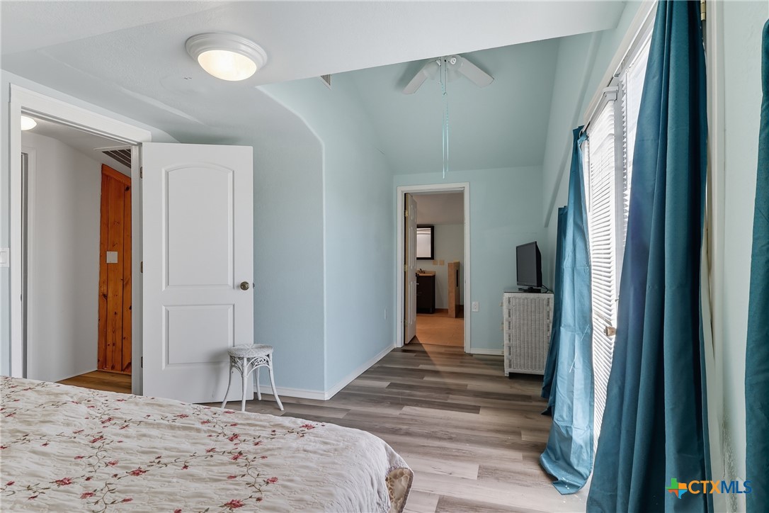 488 Alamo Beach Avenue Port Lavaca, TX 77979 - Photo 19 of 36 a bedroom with a bed and a large mirror in it