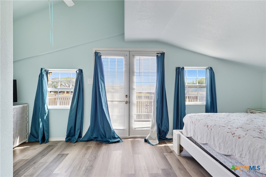 488 Alamo Beach Avenue Port Lavaca, TX 77979 - Photo 28 of 36 a bedroom with a bed and a large window
