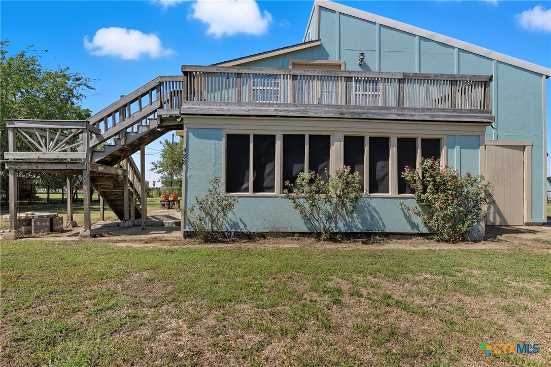 488 Alamo Beach Avenue Port Lavaca, TX 77979 - Photo 5 of 36 a front view of a house with a yard