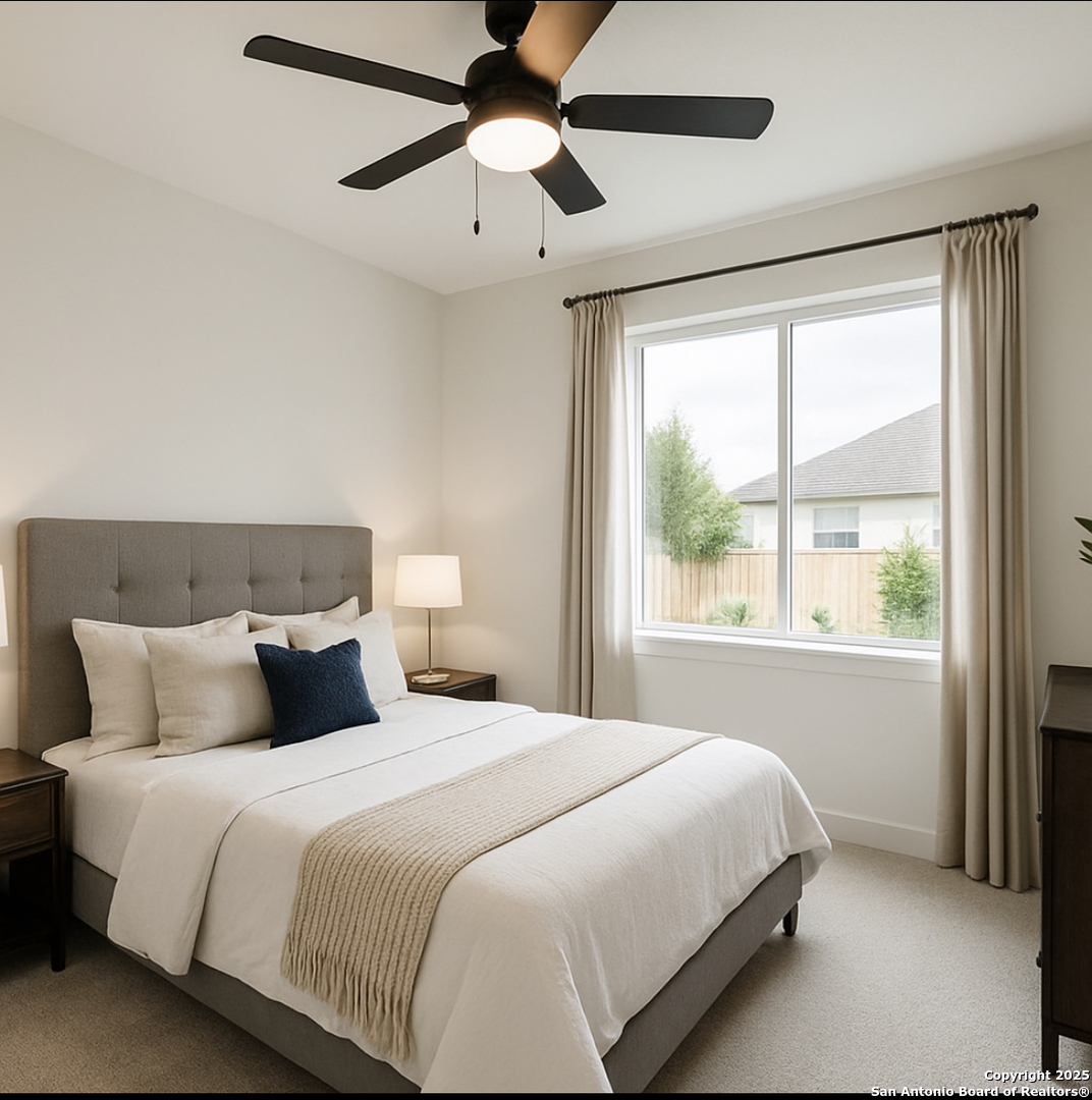 12523 Point Summit San Antonio, TX 78253 - Photo 4 of 10 a bedroom with a large bed and a large window