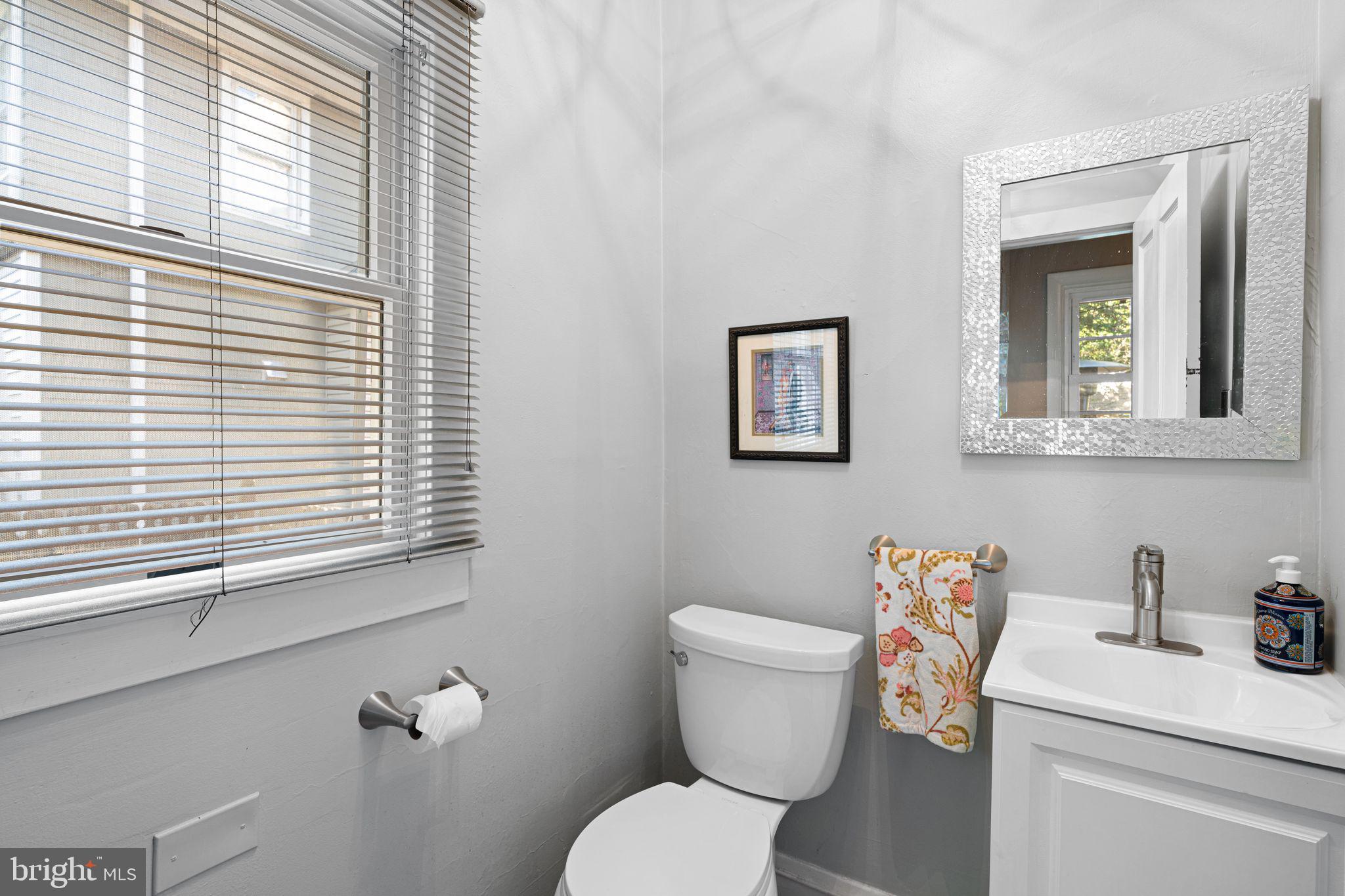 63 Trueman Avenue Haddonfield, NJ 08033 - Photo 17 of 46 a white toilet sitting next to a bathroom sink