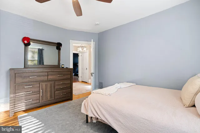 a bedroom with a bed and a dresser