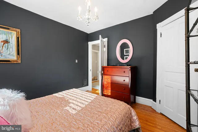 a bedroom with a bed and a closet