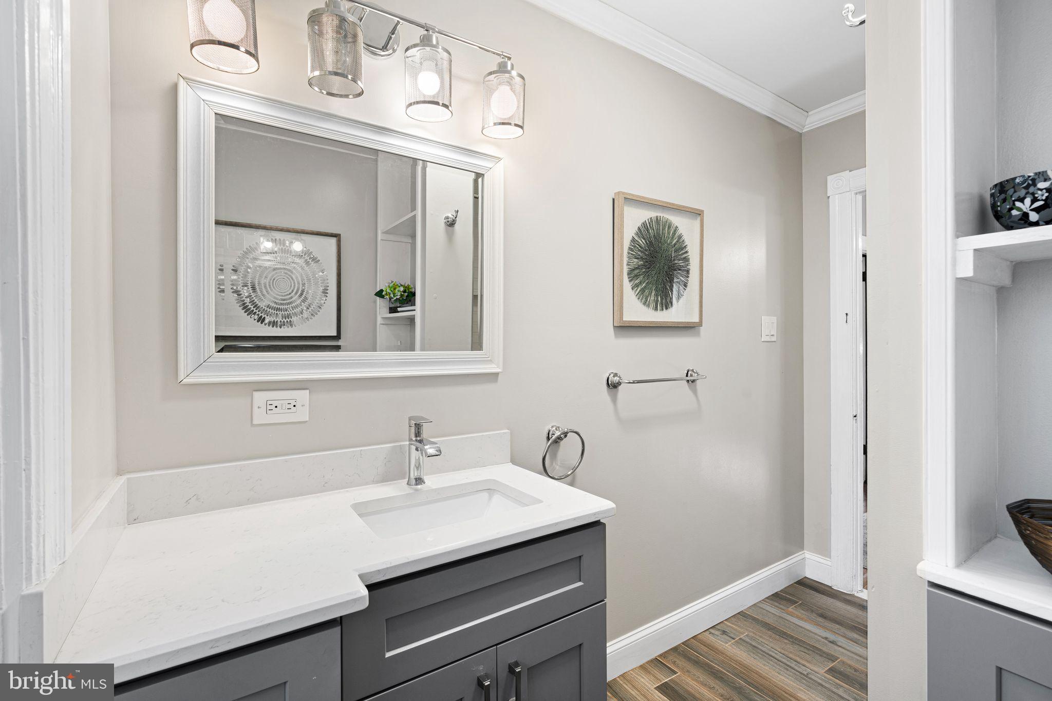 63 Trueman Avenue Haddonfield, NJ 08033 - Photo 26 of 46 a bathroom with a sink and a mirror
