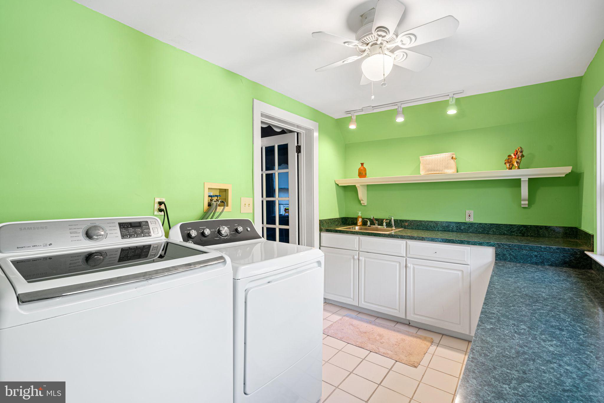63 Trueman Avenue Haddonfield, NJ 08033 - Photo 29 of 46 a room with washing machine and a chandelier