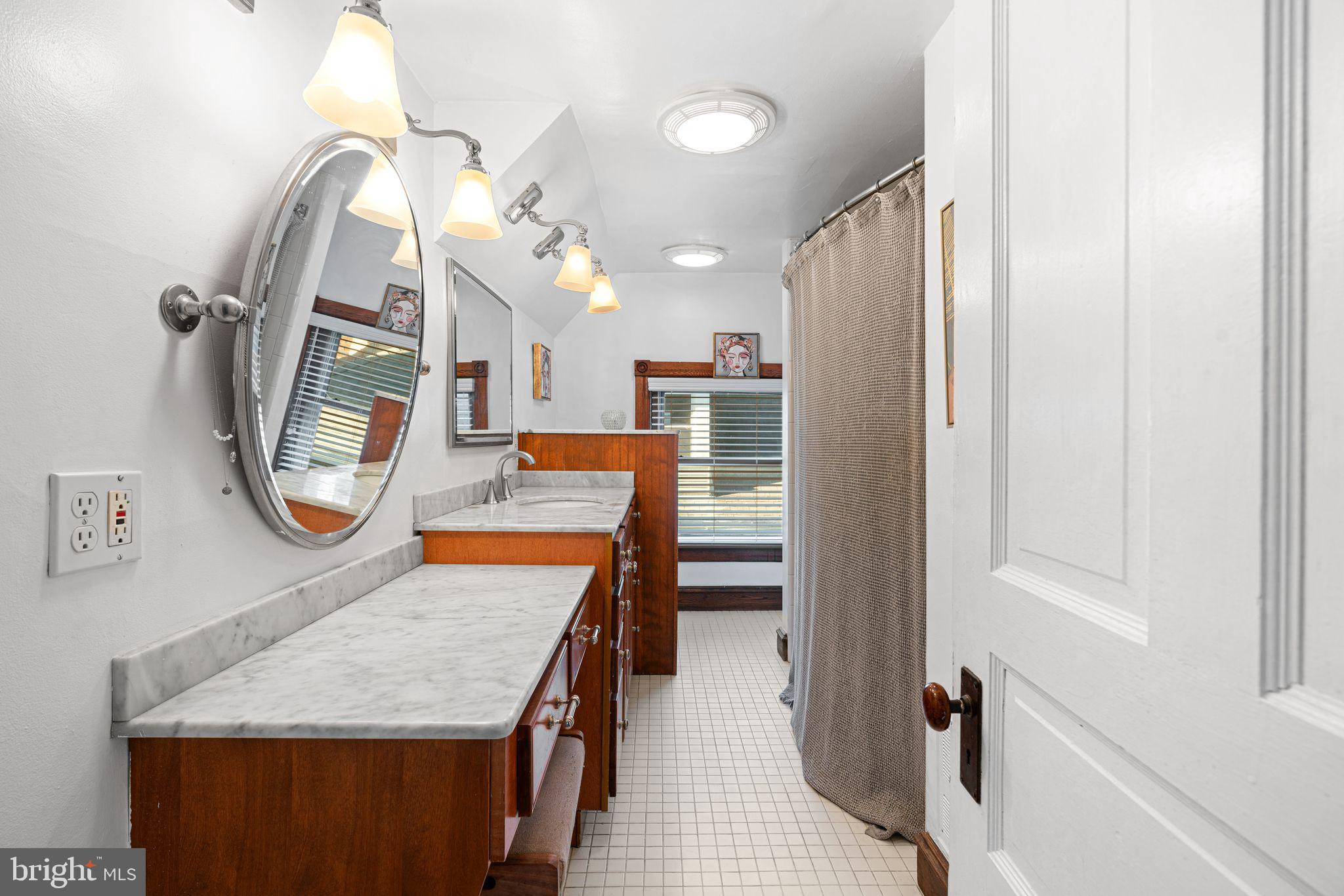 63 Trueman Avenue Haddonfield, NJ 08033 - Photo 35 of 46 an entryway with a kitchen view and a wooden floor