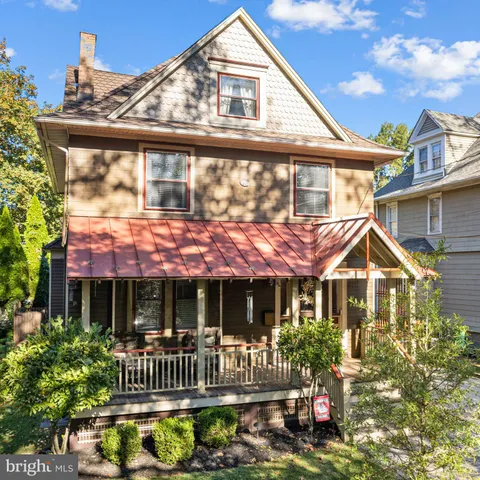 a front view of a house with a porch