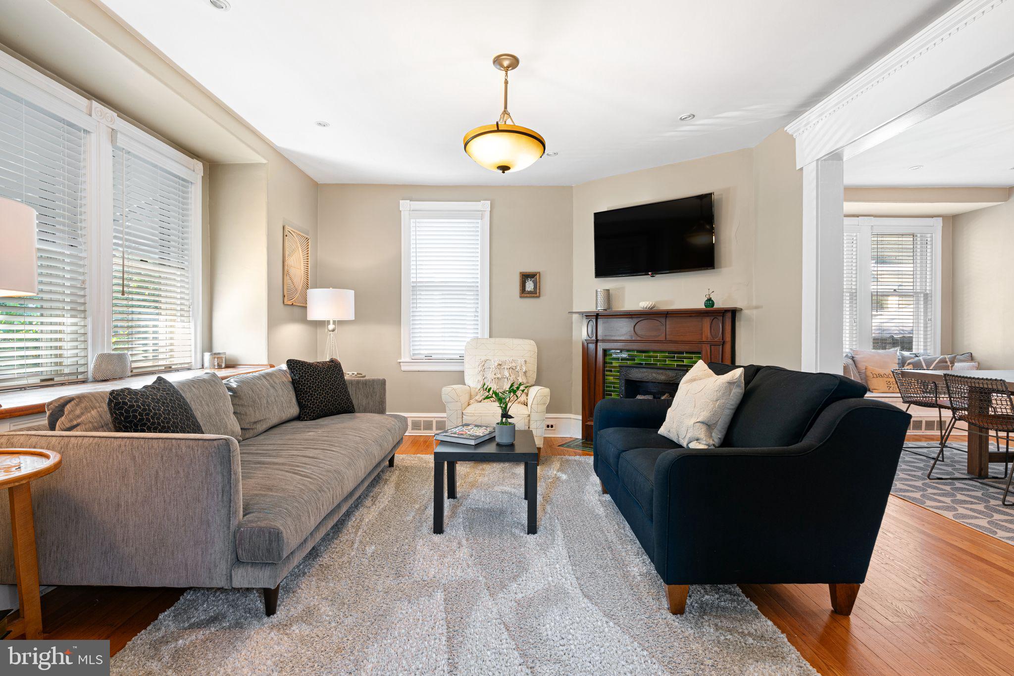 63 Trueman Avenue Haddonfield, NJ 08033 - Photo 5 of 46 a living room with furniture a flat screen tv and a window
