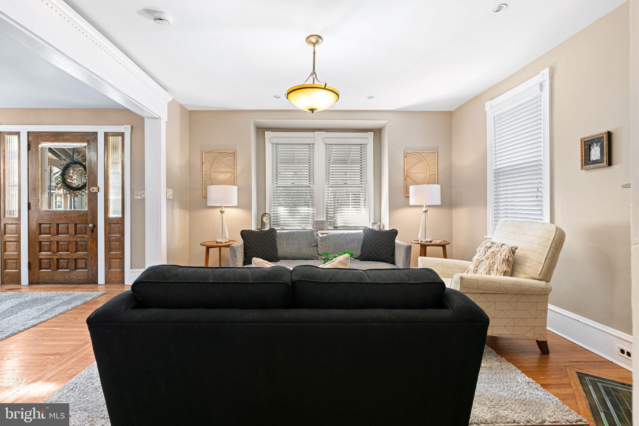 63 Trueman Avenue Haddonfield, NJ 08033 - Photo 6 of 46 a living room with furniture a window and a chandelier