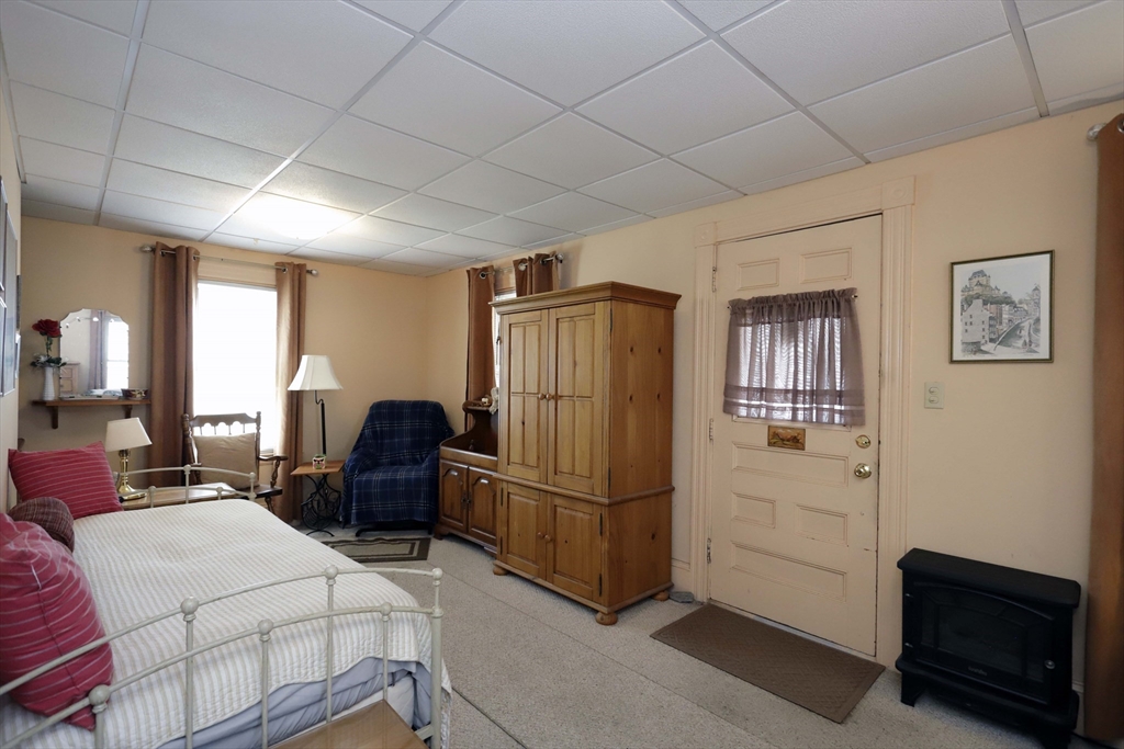 5 Anthony Street Acushnet, MA 02743 - Photo 16 of 37 a bedroom with a bed dresser and a window