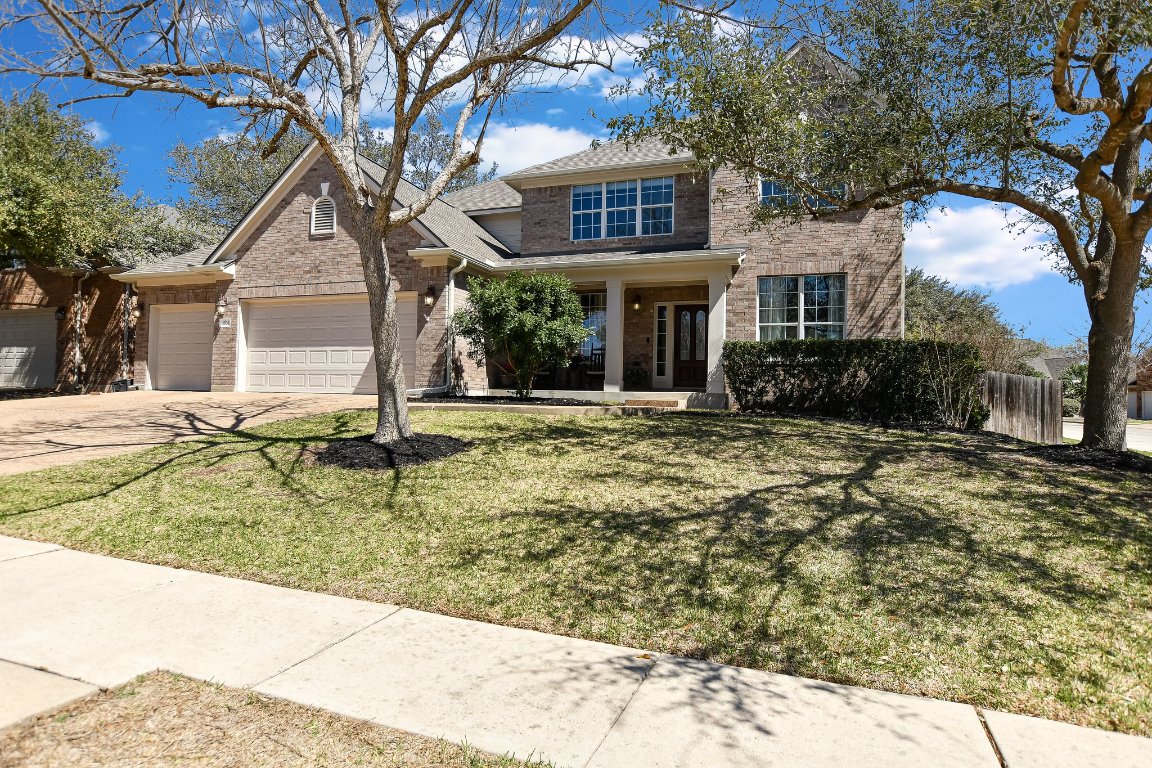 a front view of a house with garden
