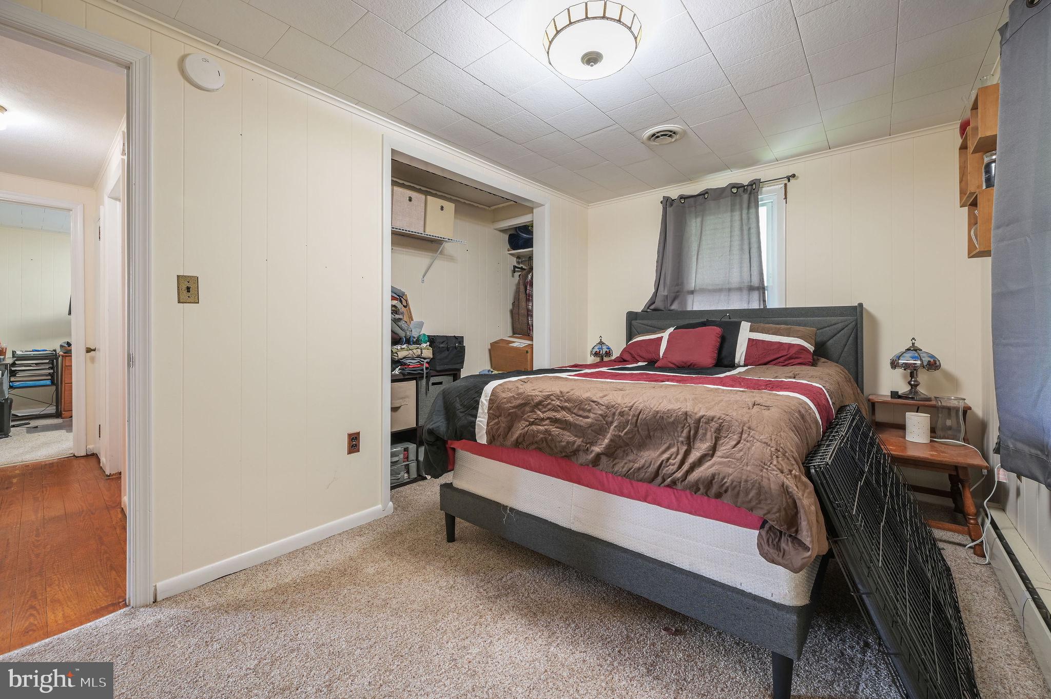 11 Simpson Street Harrington, DE 19952 - Photo 20 of 29 a spacious bedroom with a bed and a table