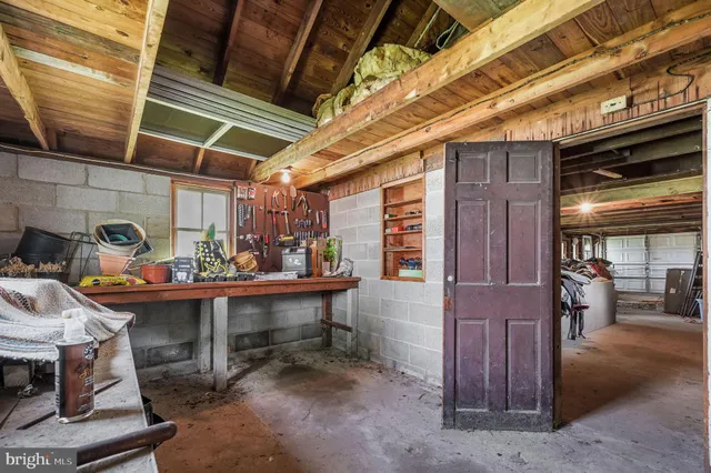 a view of a room with chairs and a table