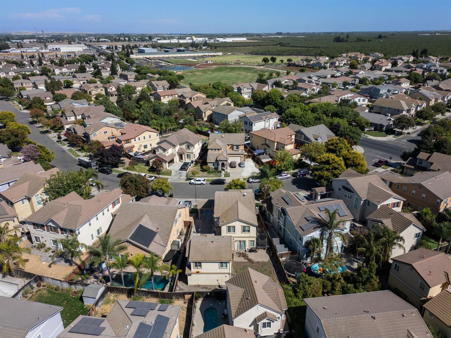 562 Ranger Street Oakdale, CA 95361 - Photo 62 of 64 aerial view of property and surrounding area with nearby suburban area